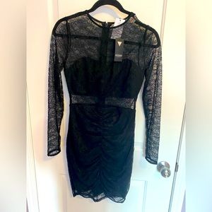 Guess Body con black Lace dress. Never worn.  Mint condition
